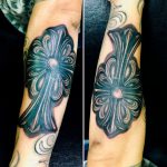 Flora Cross tattoo
