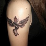 Cross and Wing Black and grey tattoo